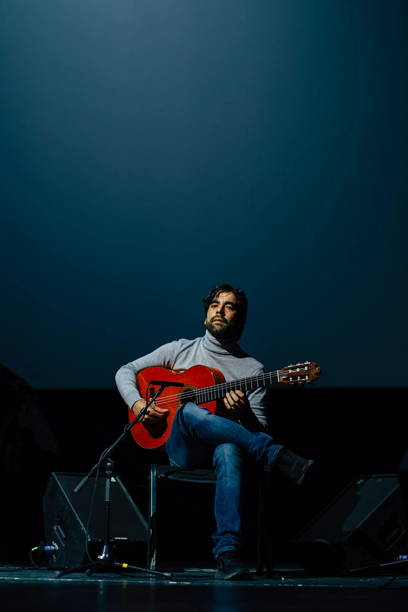 Live music portrait of a classical guitarist on stage by Lunar Lens Creative Agency