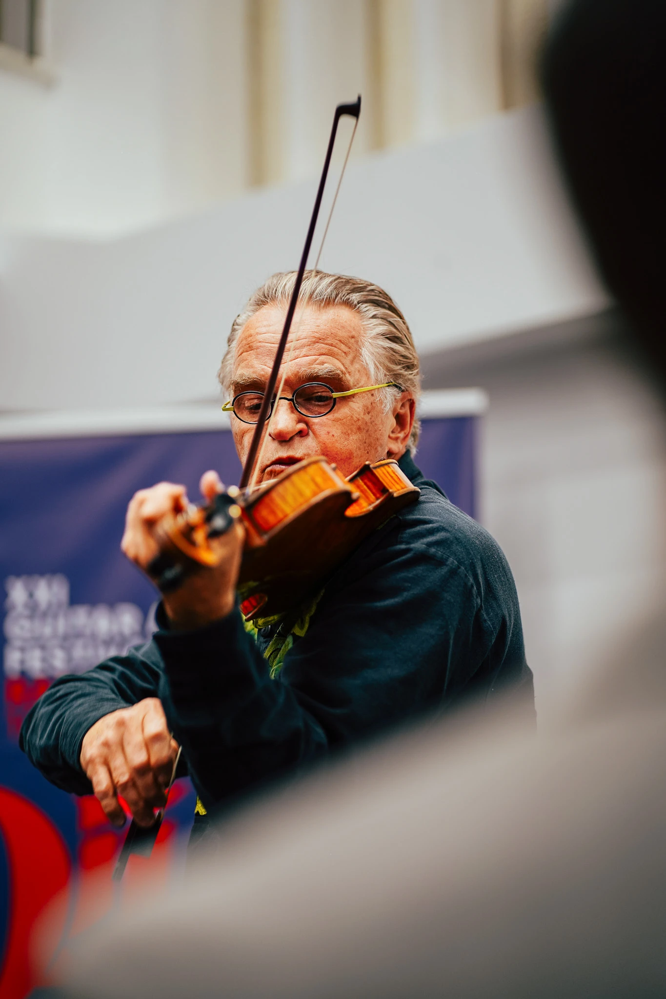 Guitar Art Festival violinist performing in close-up by Lunar Lens Creative Agency