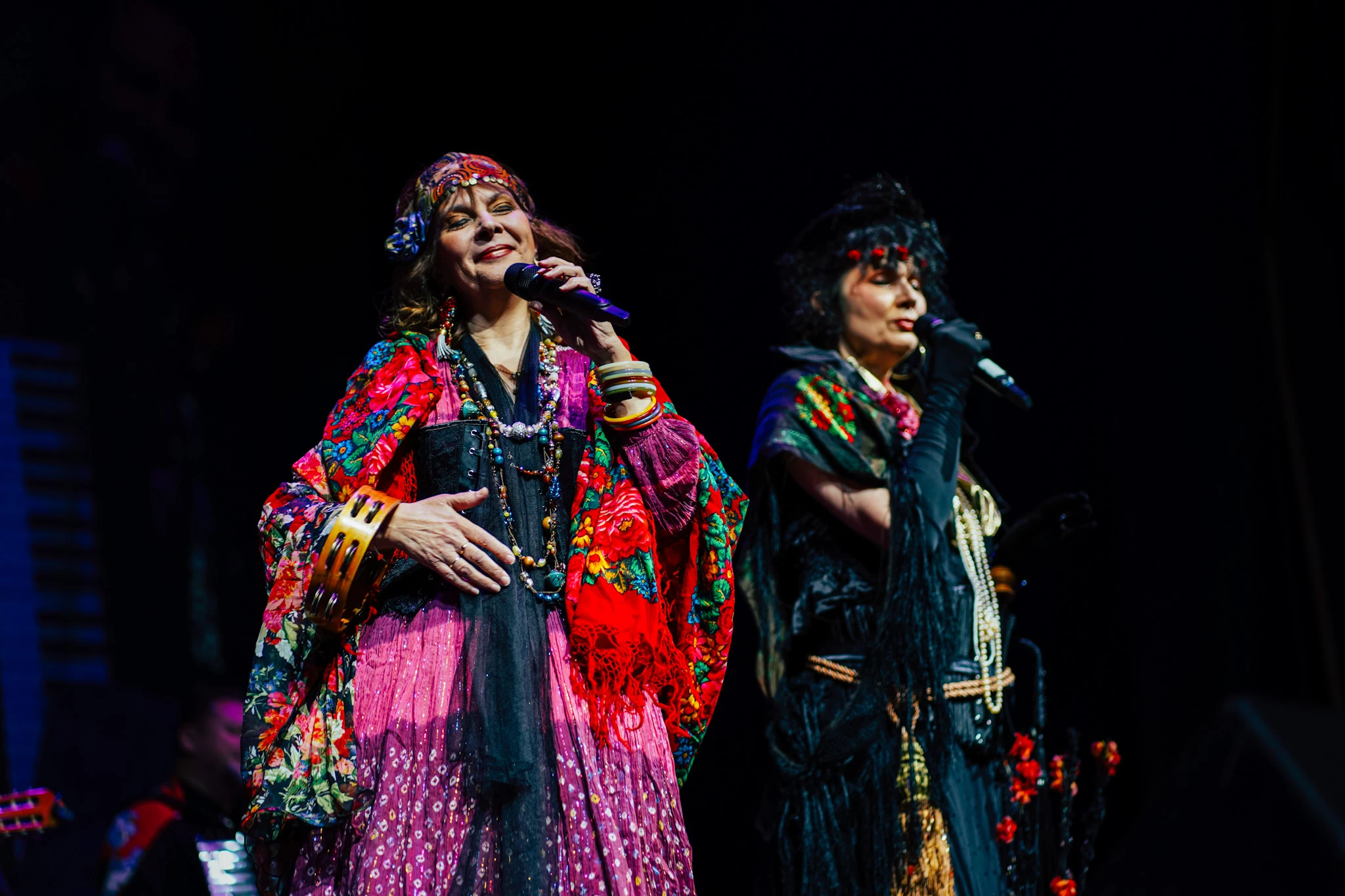 Colorful live performance photography of two singers on stage by Lunar Lens Creative Agency