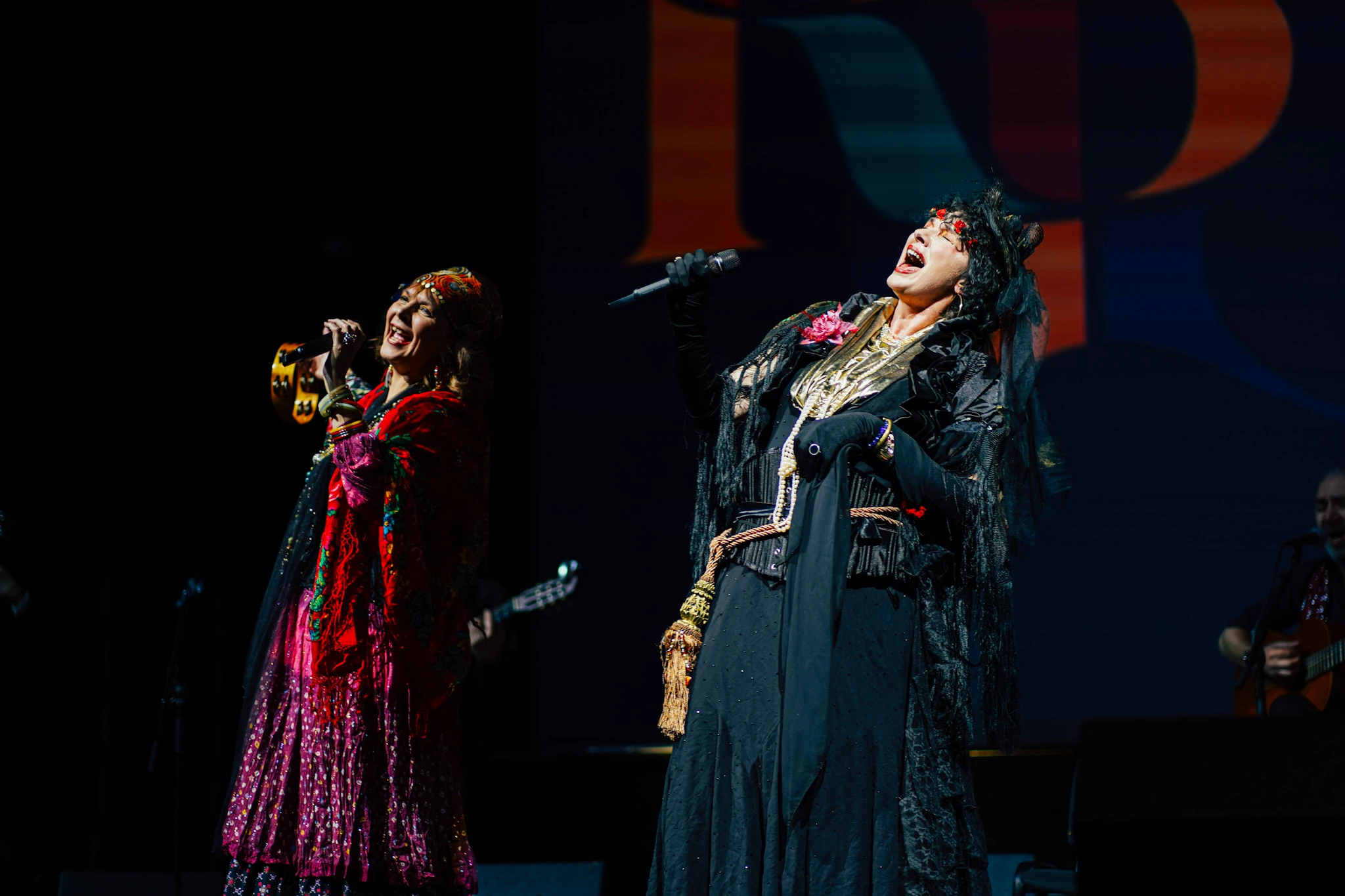 Guitar Art Festival singers performing in vibrant costumes by Lunar Lens Creative Agency