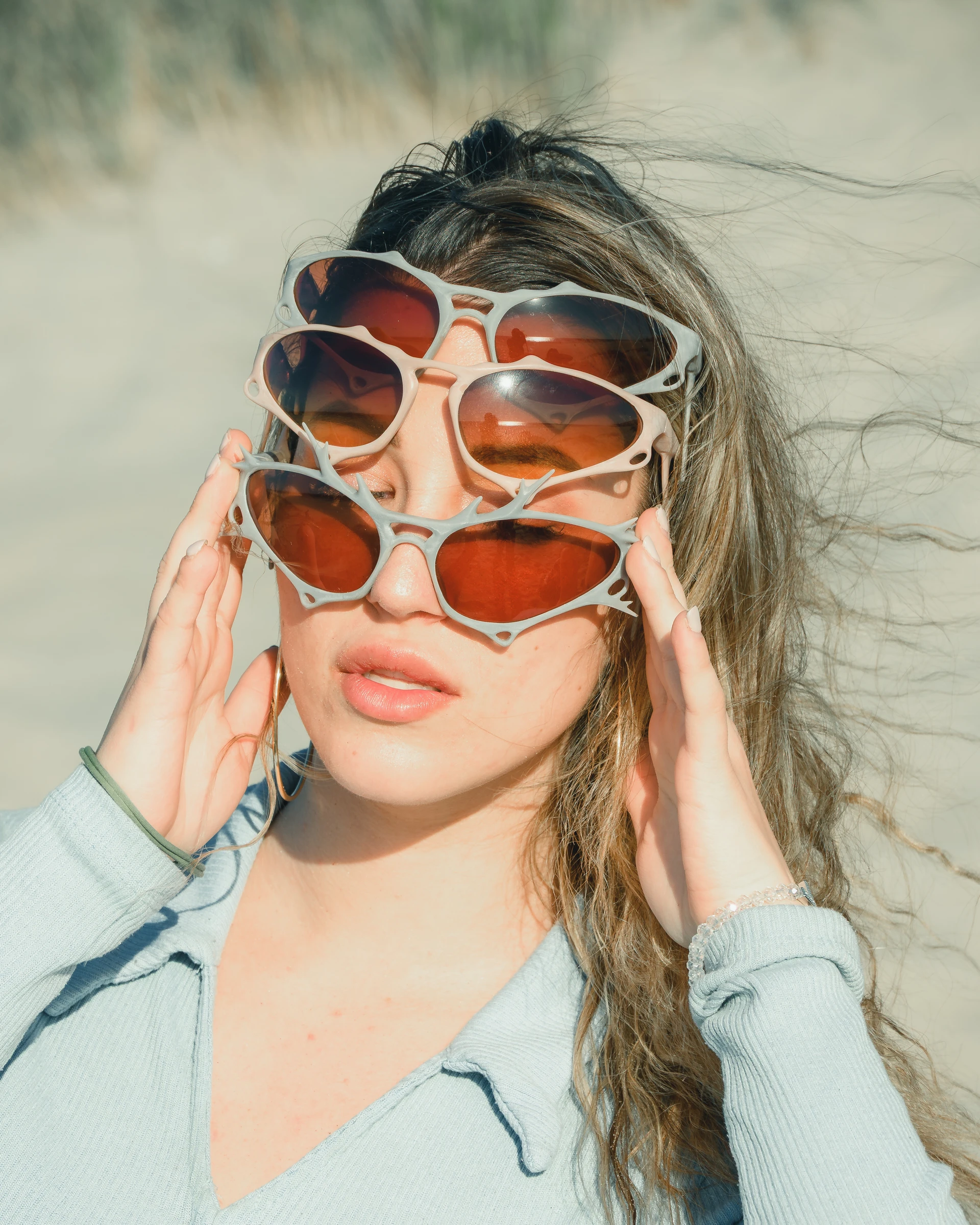 Close-up ITURA Studio sunglasses portrait in coastal dunes by Lunar Lens Creative Agency